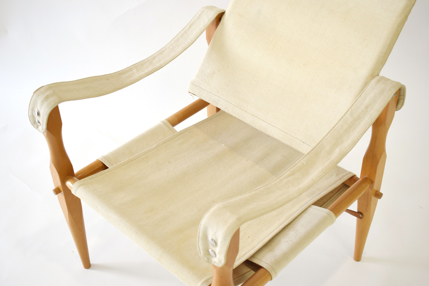 A 1960's 'Safari' chair with fabric seat and back and a beech frame CONDITION REPORT: - Image 2 of 2