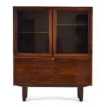 A 1960's Danish rosewood bookcase, the two glazed doors over a fall-front, on turned legs, w.