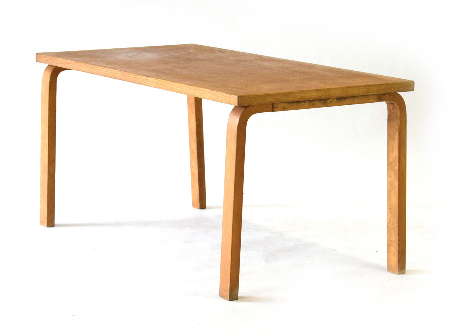 Attributed to Alvar Aalto, an oak and crossbanded dining table on bentwood-to-solid square legs, l.