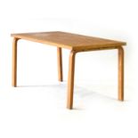 Attributed to Alvar Aalto, an oak and crossbanded dining table on bentwood-to-solid square legs, l.