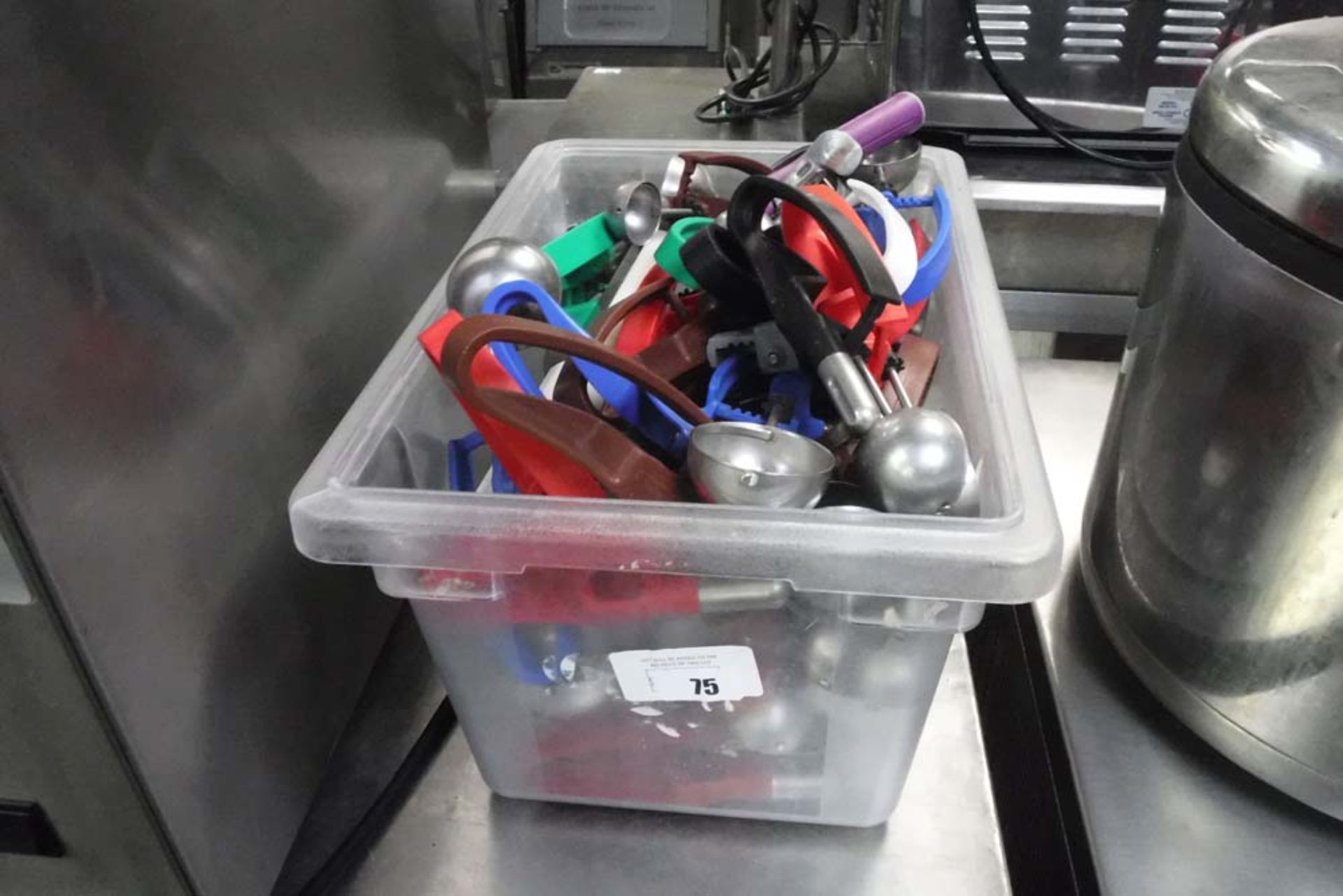 Box of assorted ice cream scoops and other utensils