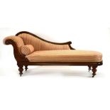 A Victorian mahogany and later upholstered chaise longue of typical form