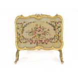 A 19th century giltwood and needlework firescreen on scrolled legs, h.