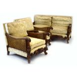 A beech and double bergere two seater sofa with acanthus-capped arms,