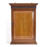 An Edwardian mahogany wall-mounted shaving cabinet, the interior with shelves and a mirror, w.