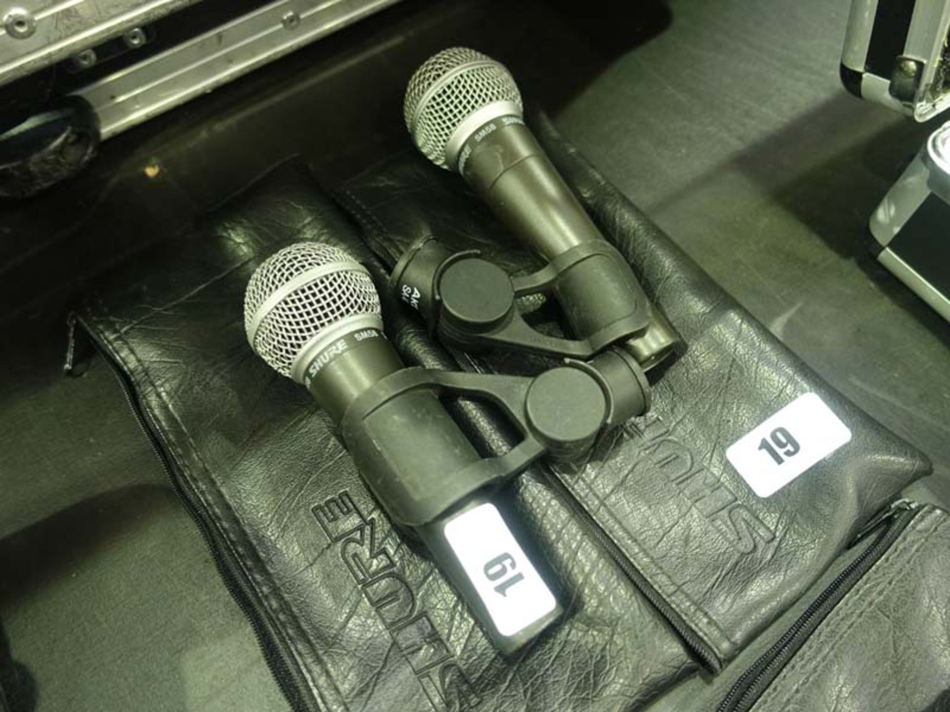 2 Shure model SM58 microphones in cases