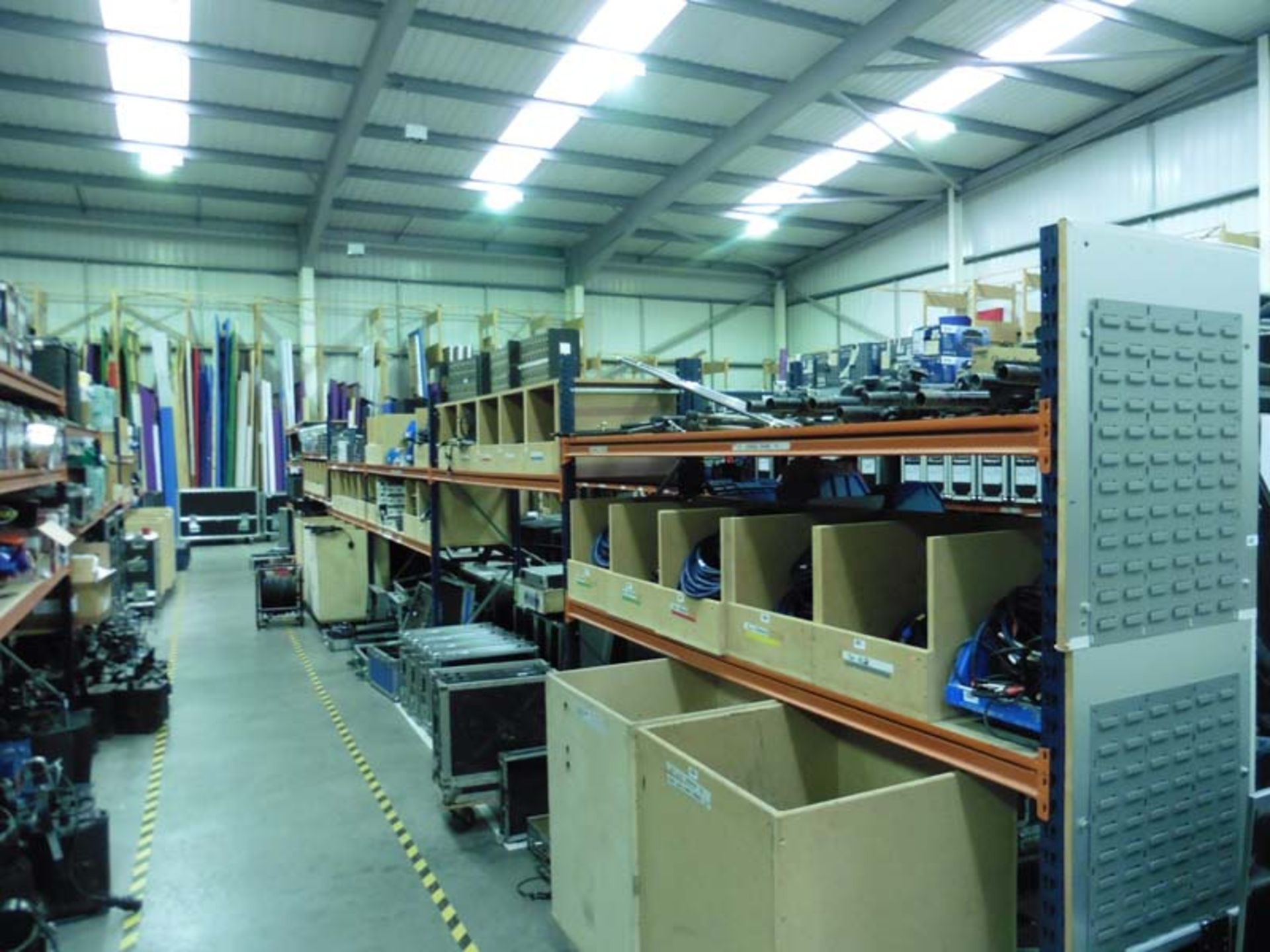 Quantity of blue and orange shelf racking in corner (not contents) (approx 11 bays)