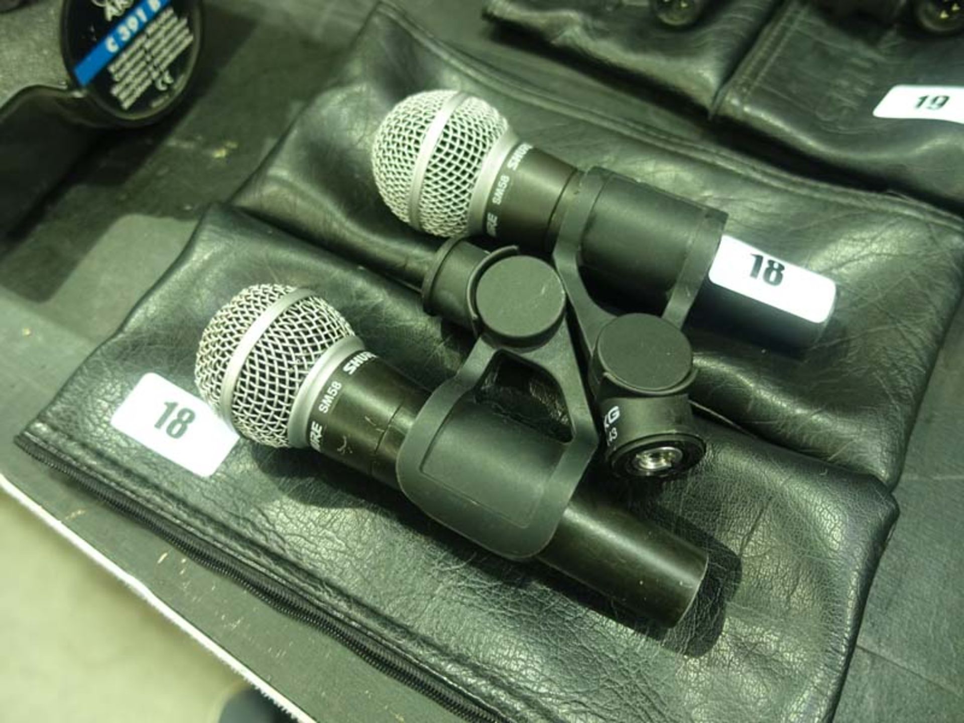 2 Shure model SM58 microphones in cases