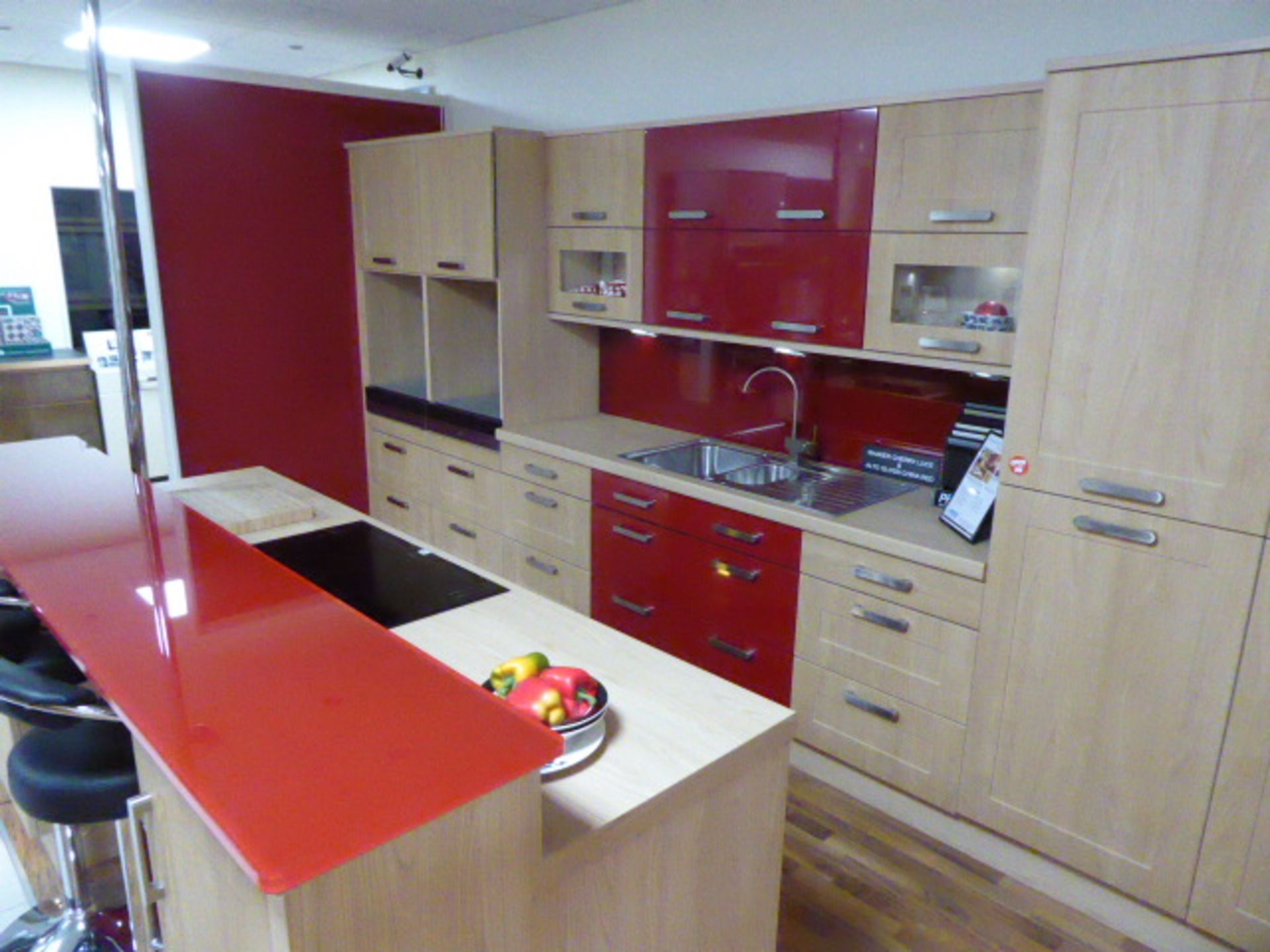 Shaker Cherry Lucce and Alto Gloss China Red kitchen with a light oak effect worktop with a matching