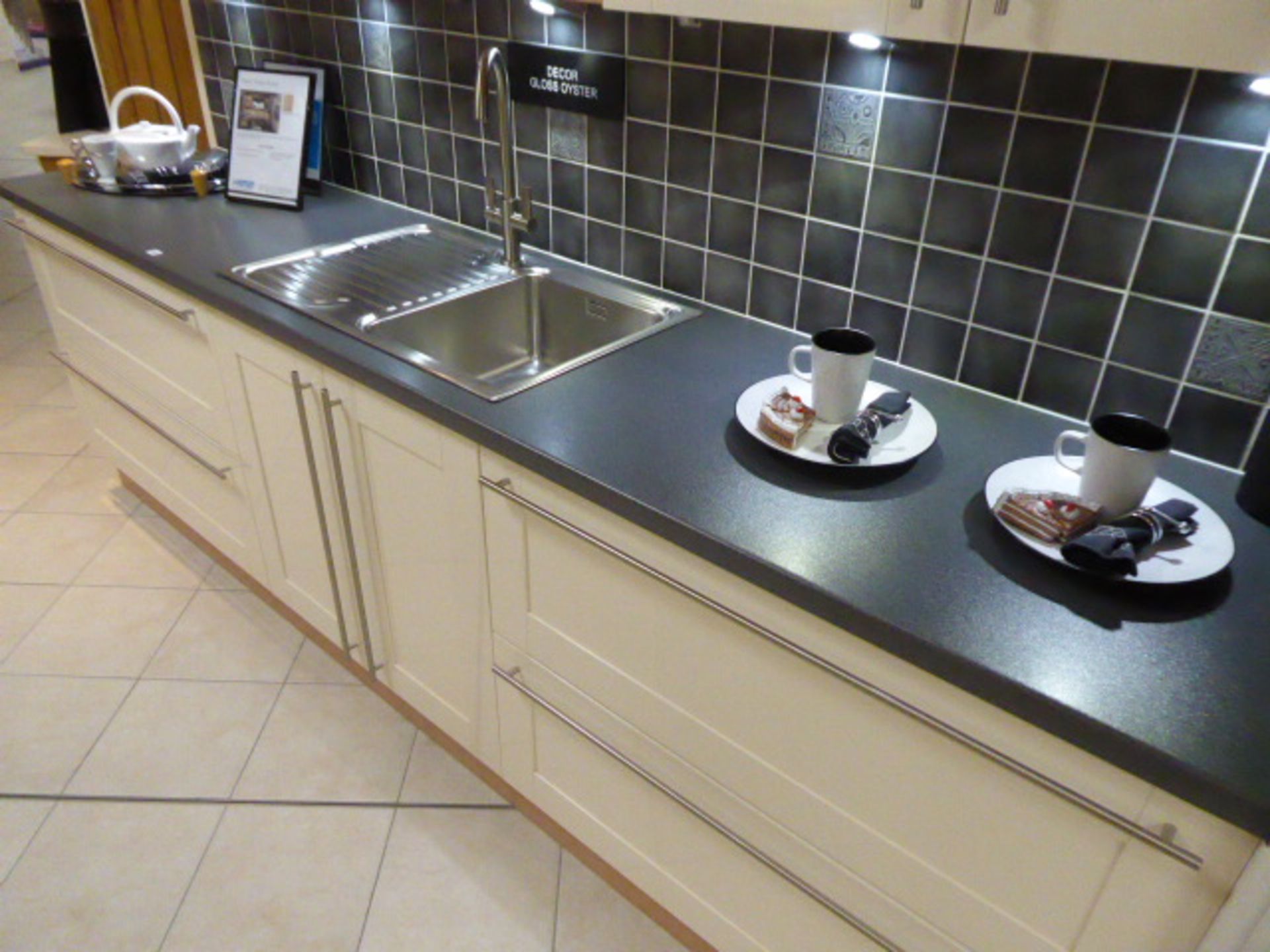 Décor Gloss Oyster kitchen with a grey granite effect worktop in single run galley. Max dimension - Image 4 of 7