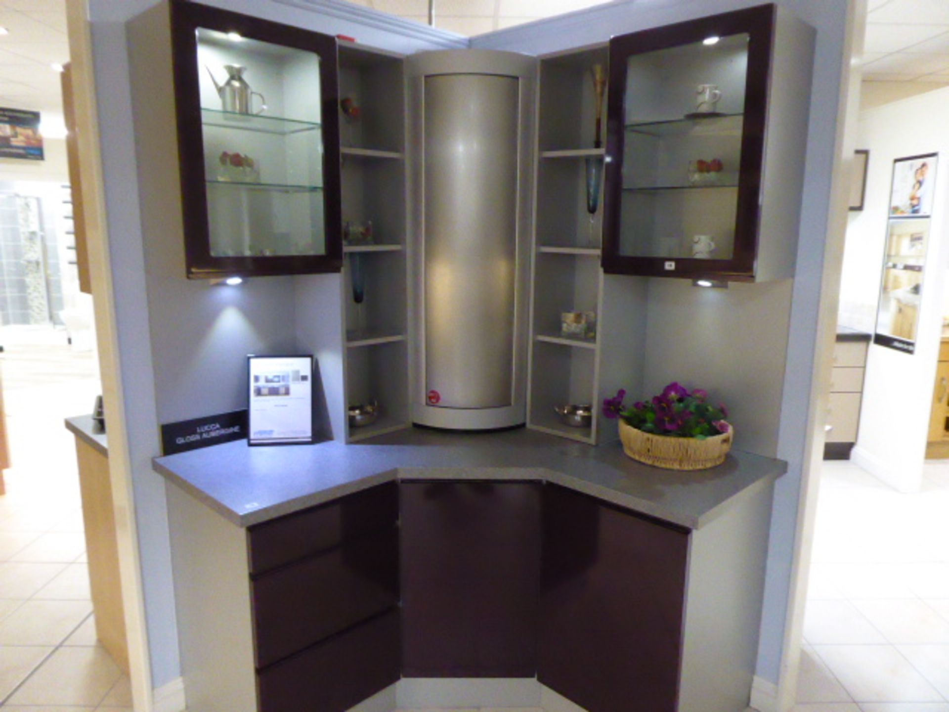 Lucca Gloss Aubergine small corner kitchen with light grey granite effect worktops. Max dimension