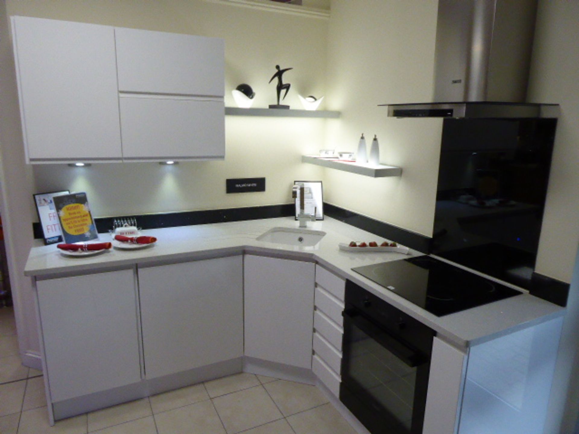 Malmo White kitchen in corner shape with a Technistone starlight white worktop. Max dimensions 200cm