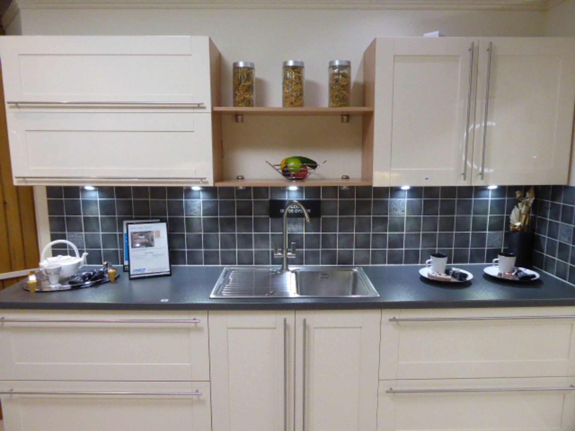 Décor Gloss Oyster kitchen with a grey granite effect worktop in single run galley. Max dimension - Image 2 of 7