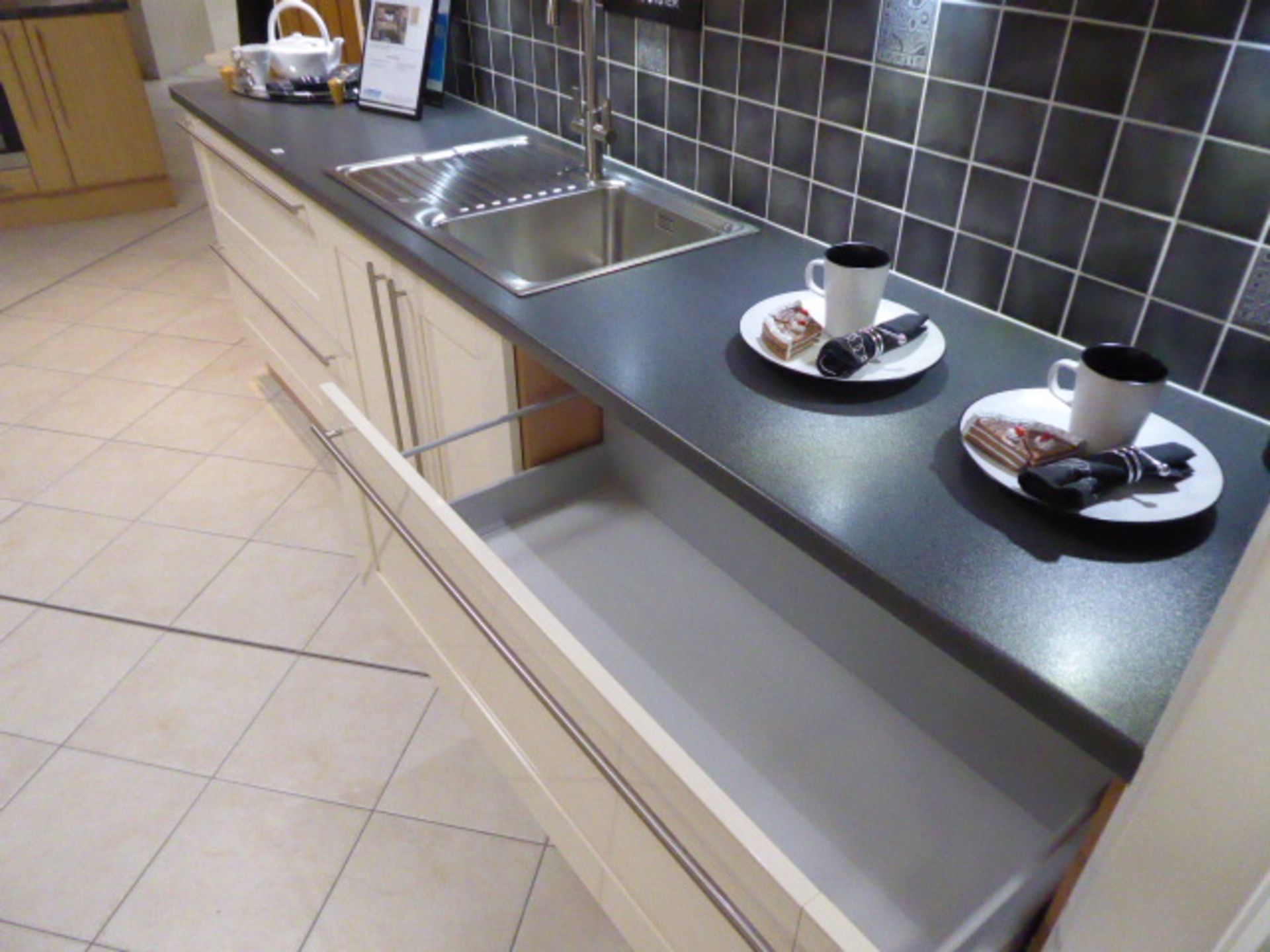 Décor Gloss Oyster kitchen with a grey granite effect worktop in single run galley. Max dimension - Image 5 of 7