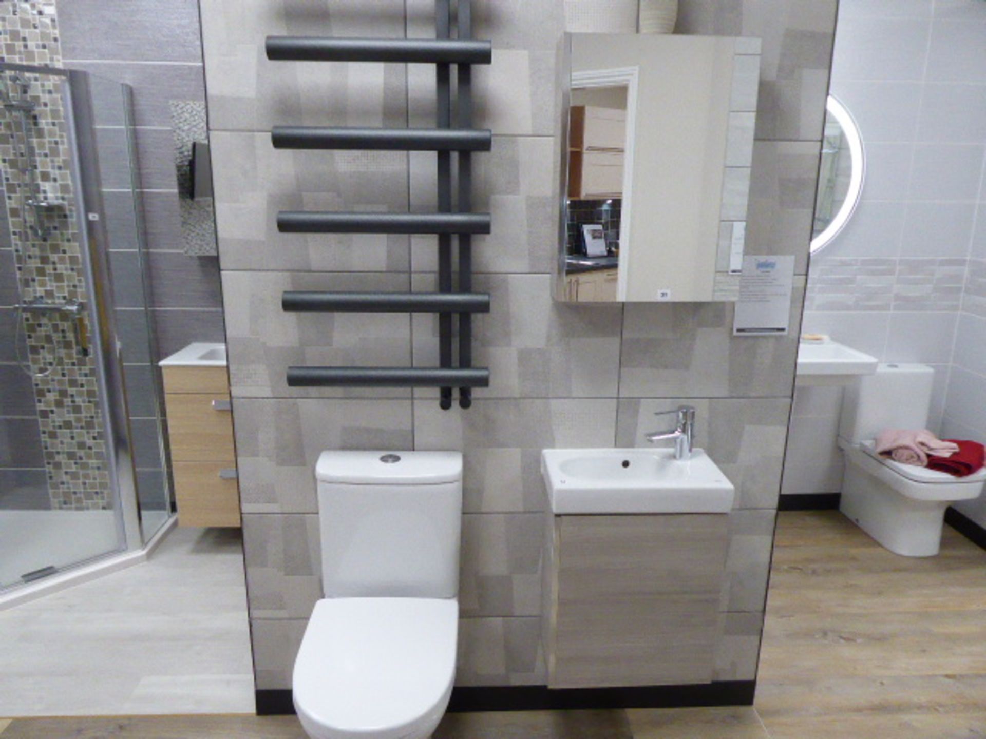 Roca Colina cloakroom set with toilet, small hand basin tap set on cabinet, wall mount cabinet and a