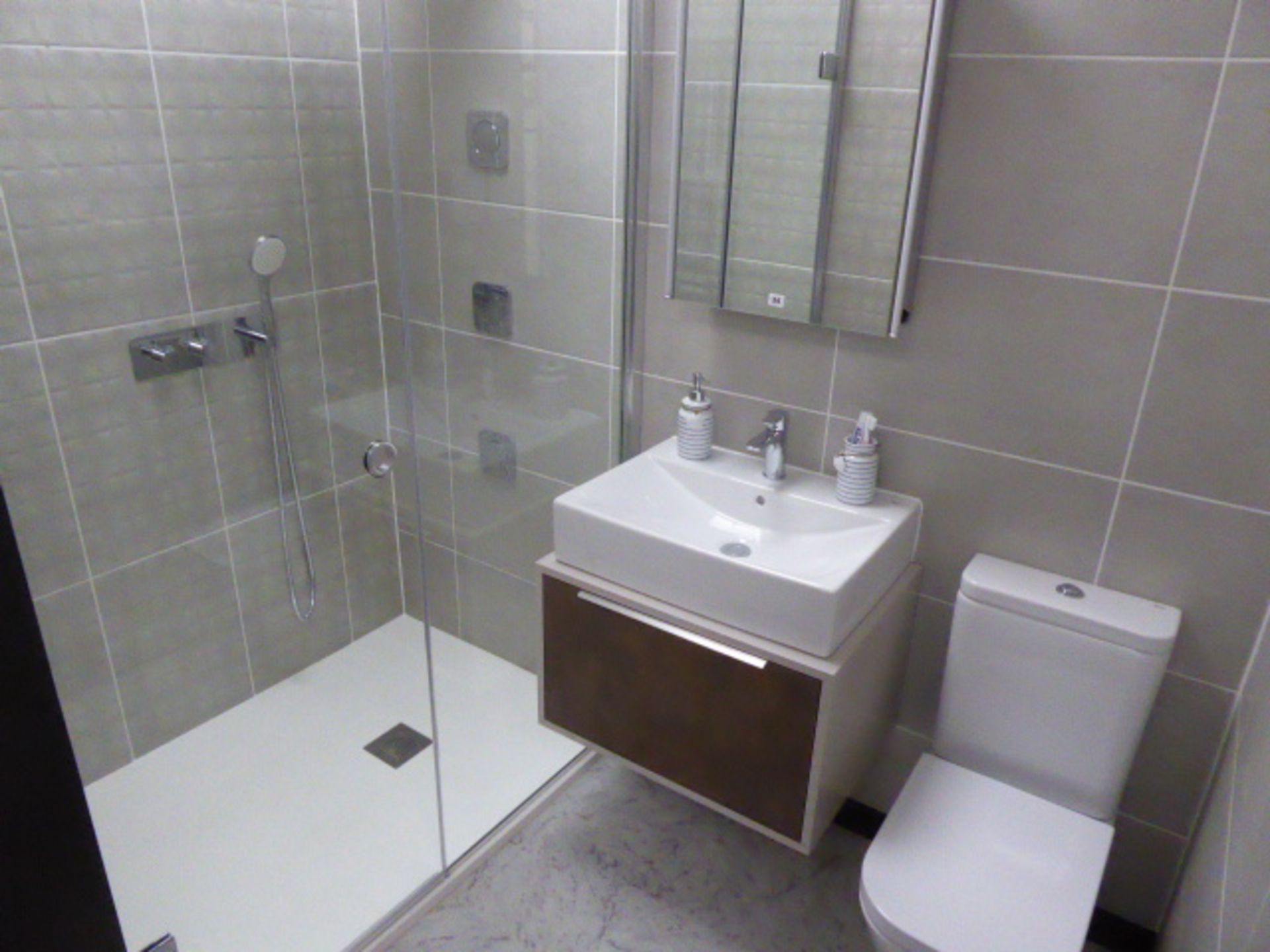 Roca Puzzle shower room comprising of large shower tray, glass single door shower screen, built in