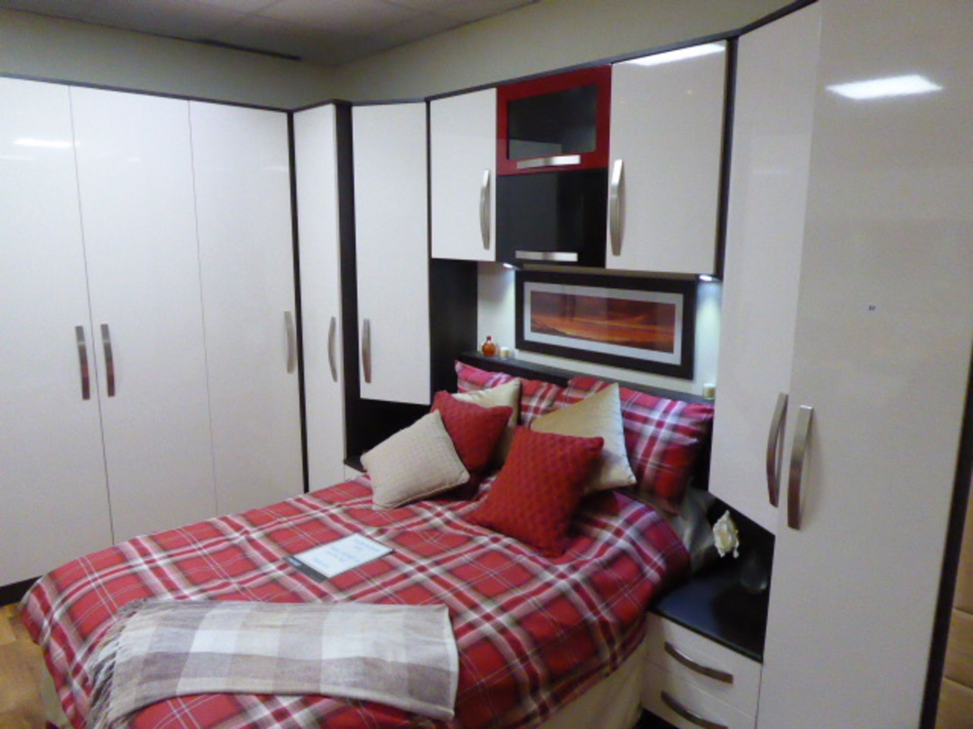 Cubist Gloss Plain Ivory built in bedroom suite comprising of wardrobes, bedside drawers, over bed