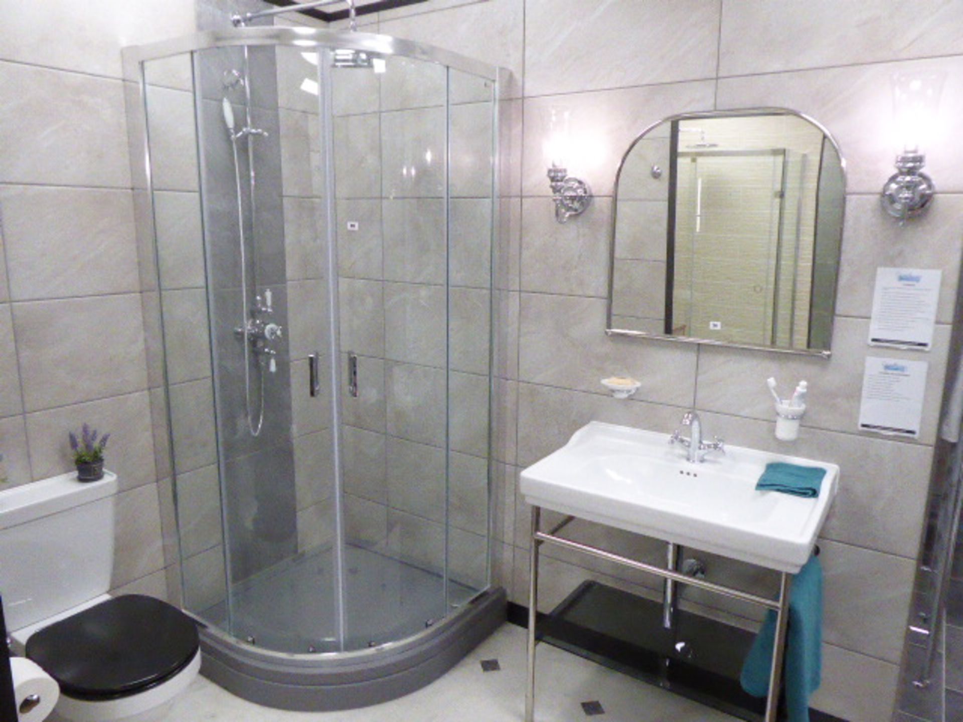 Roca Carmen shower room comprising grey quadrant shower with double sliding doors, mixer shower with