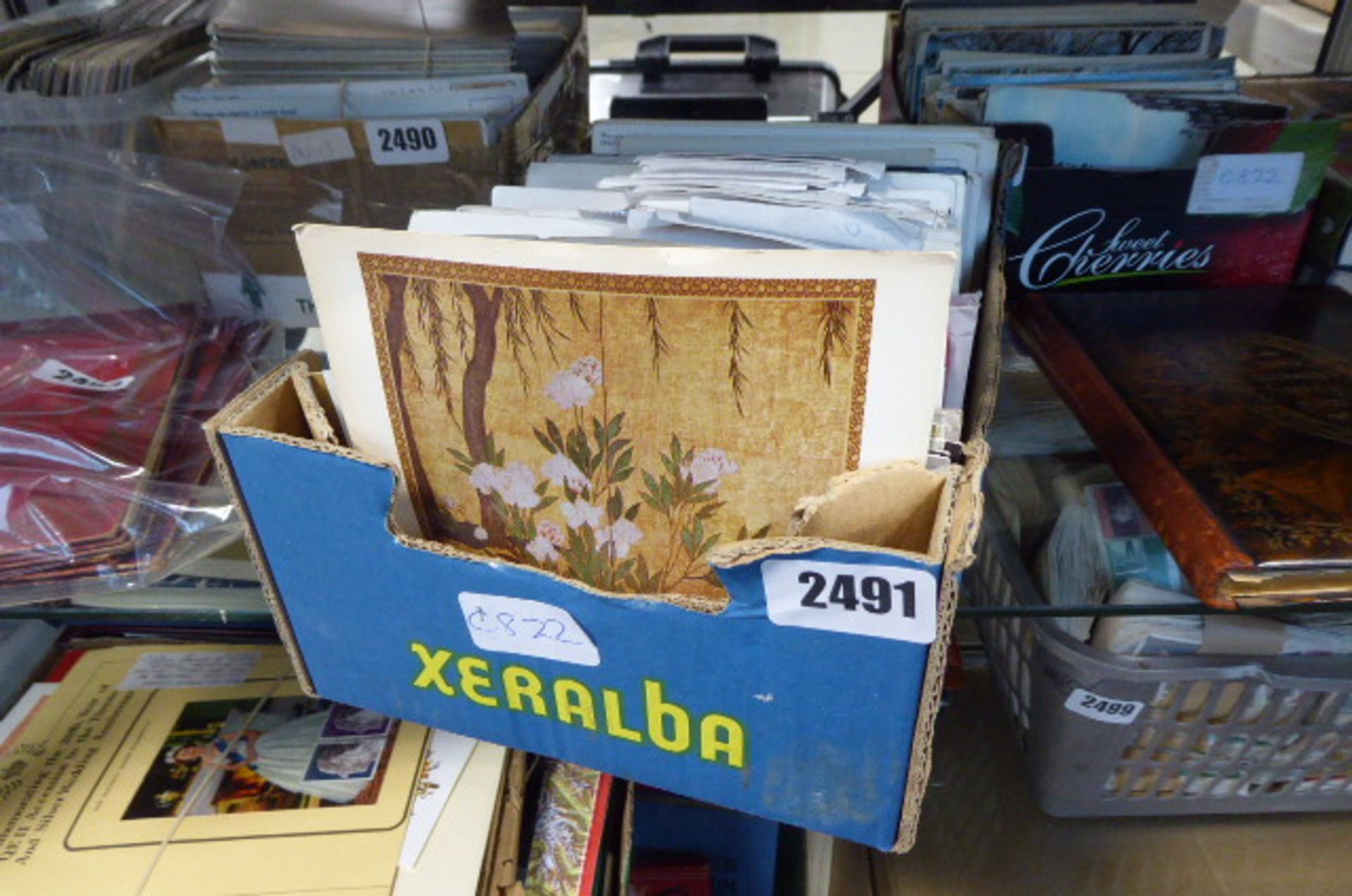 Tray containing quantity of collectible postcards