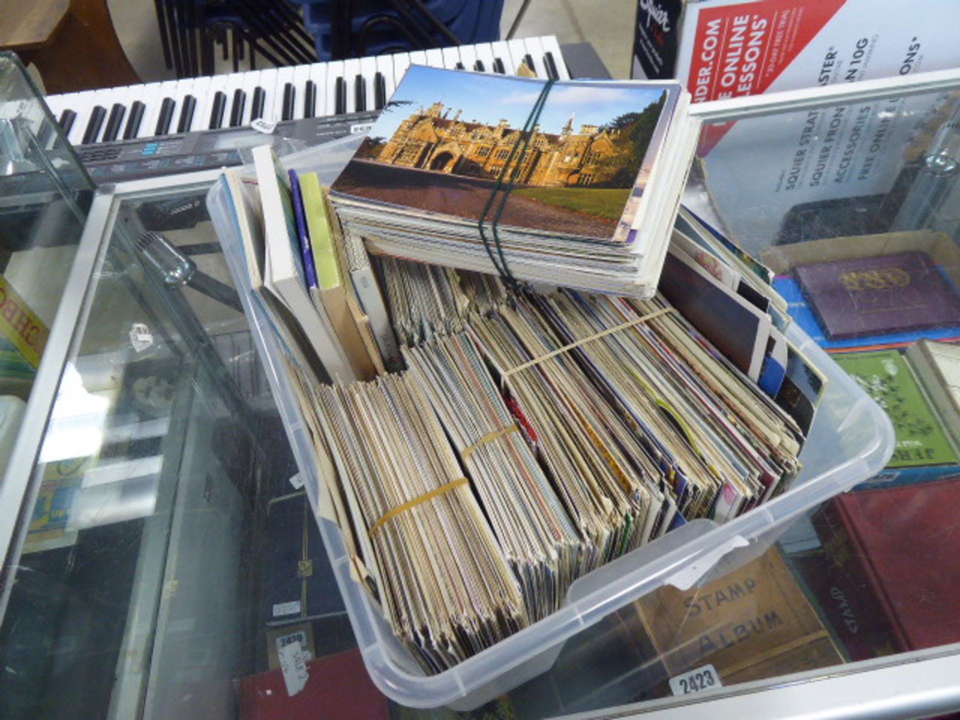 Box of mixed postcards, used and unused GB and foreign