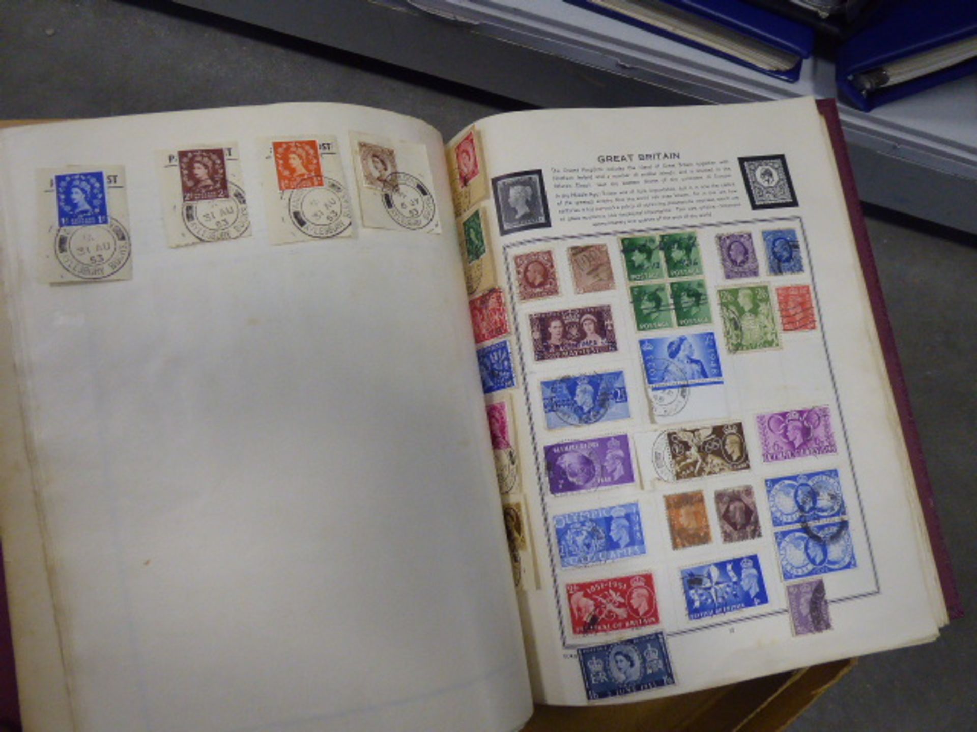 Diplomat stamp album with various world stamps including GB and Poland