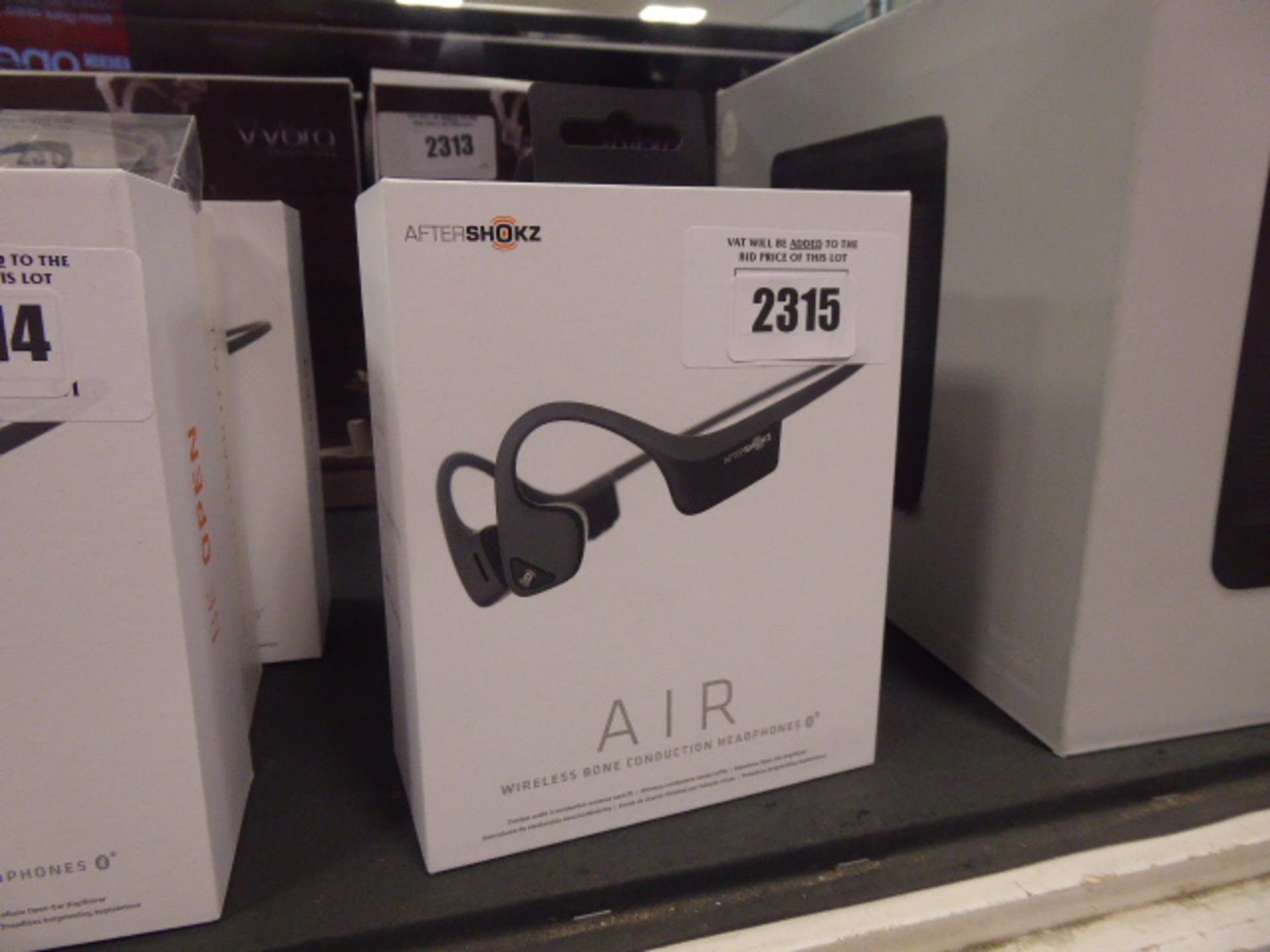 3 Aftershokz bone conduction headphones in box