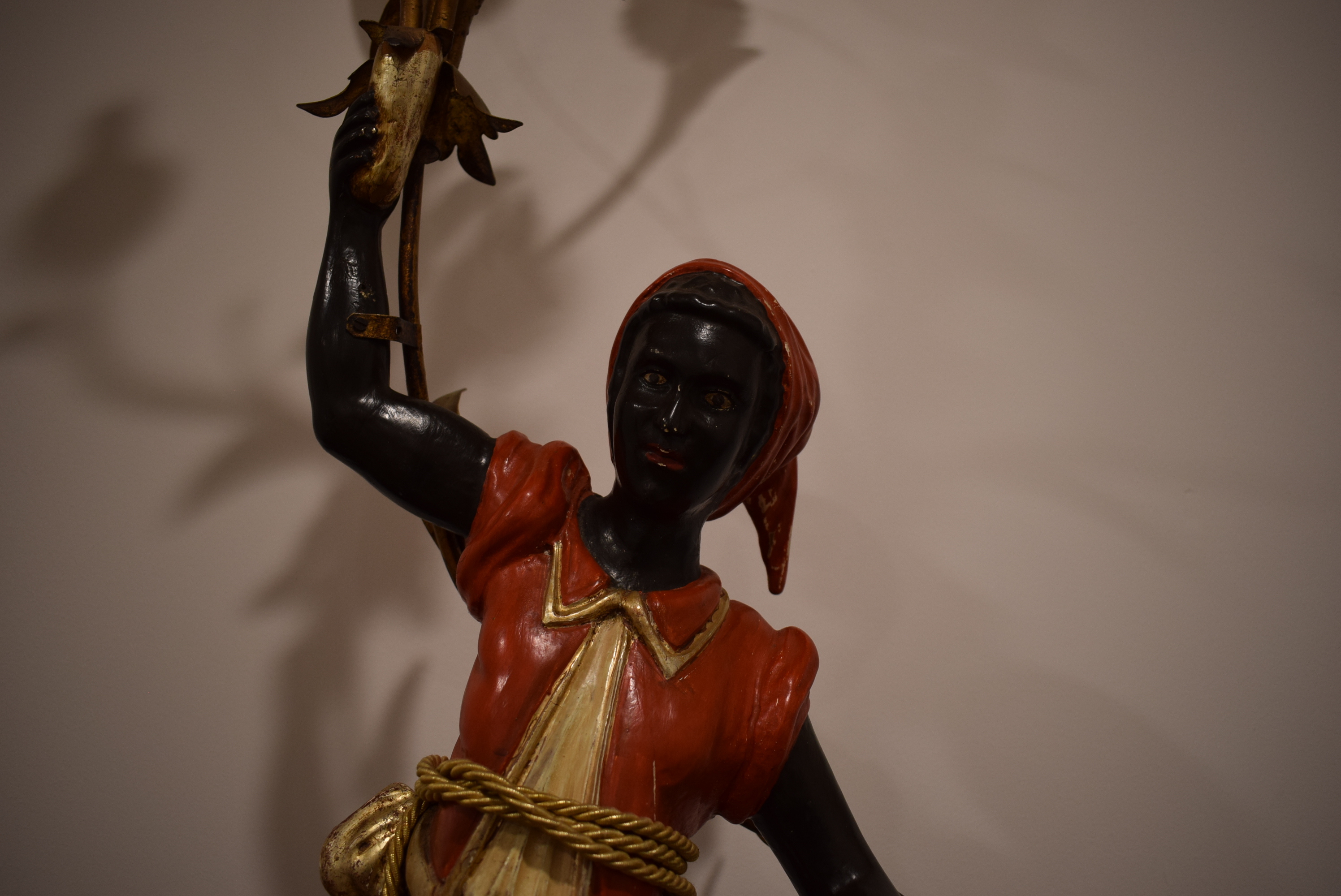 A polychrome and metalwork 'blackamoor' lamp modelled as a young man holding a five-branch foliate - Image 9 of 13