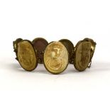 A base metal bracelet set seven lava cameos depicting classical figures head and shoulders,