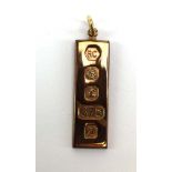 A 9ct yellow gold ingot pendant, Sheffield 1978, 4.