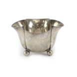 An Edwardian silver bowl of flowerhead form on ball feet, Horace Woodward & Co. Ltd., London , w. 9.