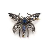 A yellow and white metal highlighted brooch in the form of a butterfly set small diamonds,