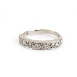 An 18ct white gold half eternity ring set seven brilliant cut diamonds in recessed settings,