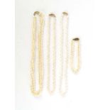 A three strand baroque pearl necklace with 14ct yellow gold clasp,