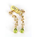 A pair of 9ct yellow gold ear pendants, each set three small pearls and a teardrop peridot, l.