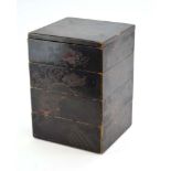 A Japanese black lacquered four stage box,