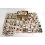 Forty-two sets of Players, Churchmans and Wills cigarette cards relating to military uniforms,