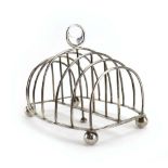 A George IV silver six section toast rack on four ball feet, maker CF, London 1828, w. 14.