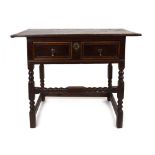 A late 17th century oak side table, the frieze with a single drawer,