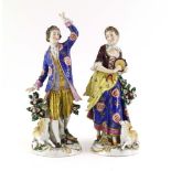 A pair of 18th century-style figures modelled as a dandy and his female companion,