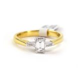 An 18ct yellow gold ring set step cut diamond,
