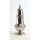 A silver pepper of typical vase shaped form, maker DJS, London , h. 11.