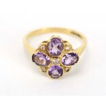 A 19th century-style 9ct yellow gold cluster ring set four oval amethyst and five small diamonds,