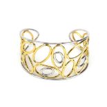 A modern 9ct two colour cuff bracelet of openwork design, 11.