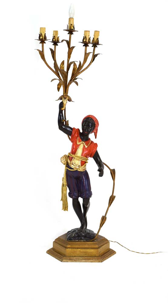 A polychrome and metalwork 'blackamoor' lamp modelled as a young man holding a five-branch foliate