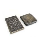 An Anglo-Indian metalware cigarette case of rectangular form repousse decorated with floral sprays,