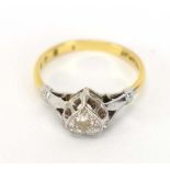 An 18ct yellow gold and platinum highlighted ring set small diamond in a heart shaped setting,