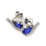 A pair of 14ct white gold ear studs of teardrop design set oval tanzanite and small diamonds, l. 1.