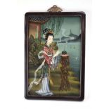 An early/mid-20th century Chinese reverse painting on glass depicting a traditional female by a