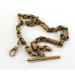 A yellow metal fancy link watch chain, lobster clasp stamped '9c' suspending a gold plated t-bar,