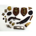 A mixed group of collectable's including a kukri knife, badges, a lacquered box, brass padlocks,